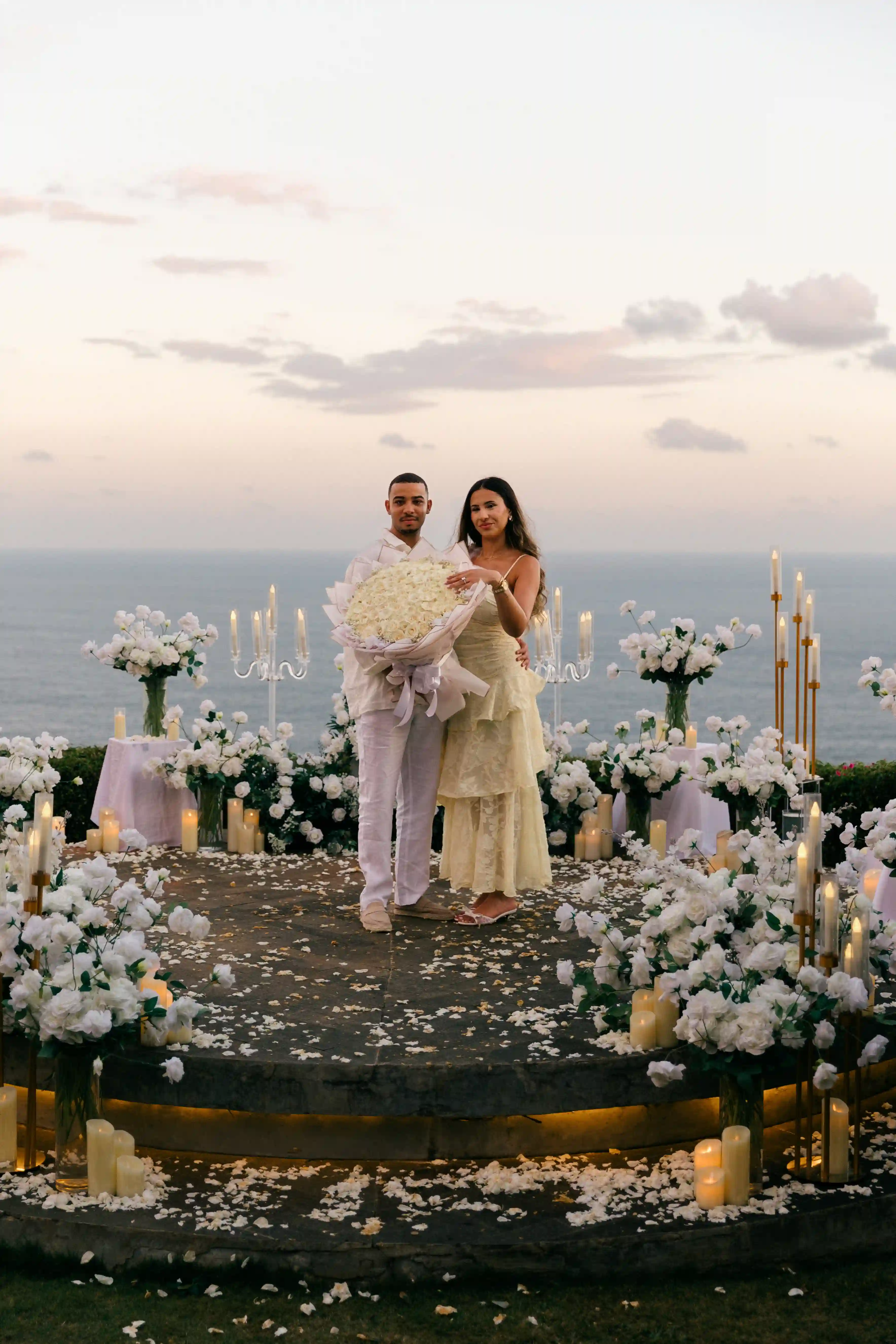Romantic cliff proposal above the ocean in Bali at golden hour