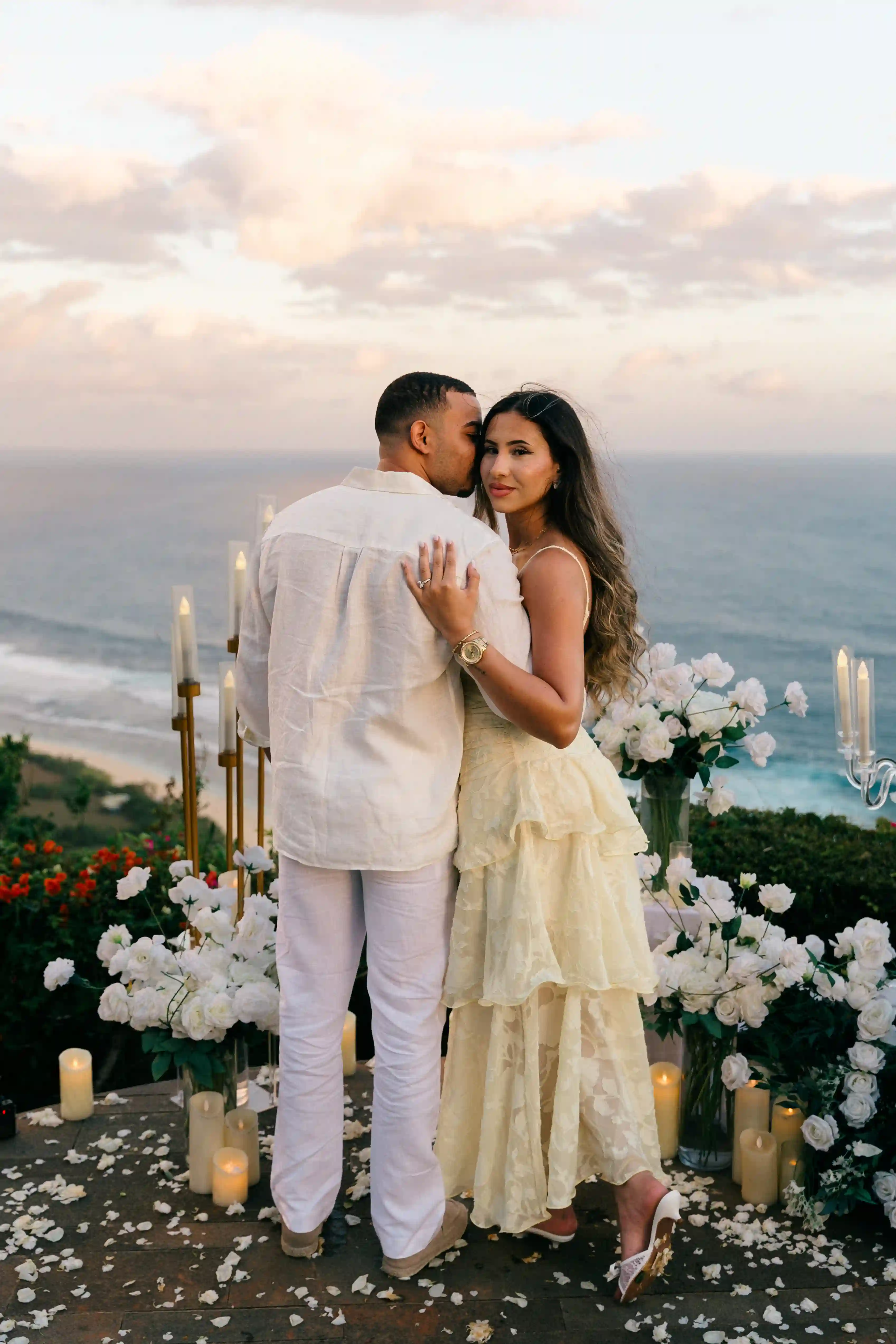 Surprise marriage proposal on a Bali clifftop at sunset