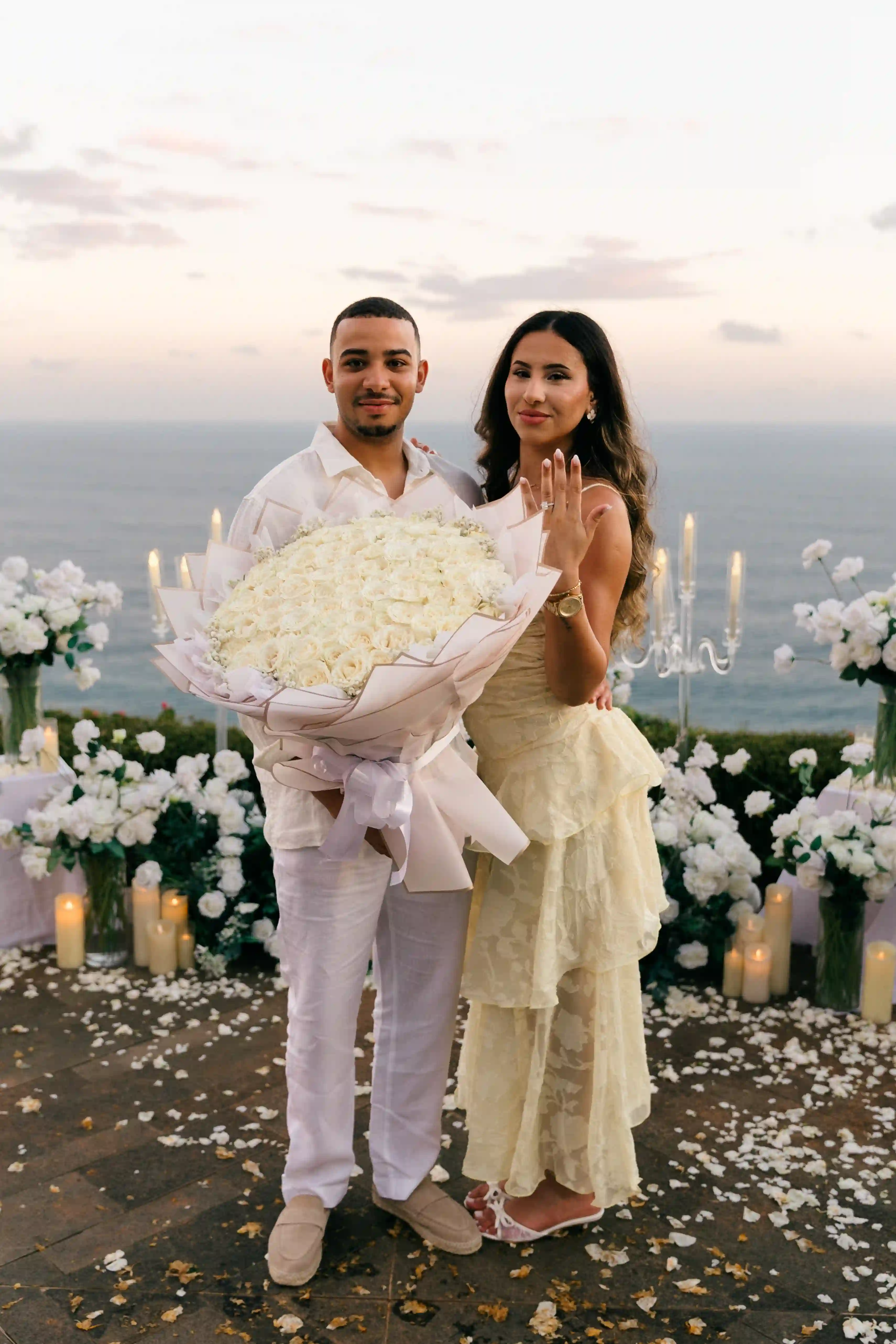 Marriage proposal with white florals on a Bali clifftop