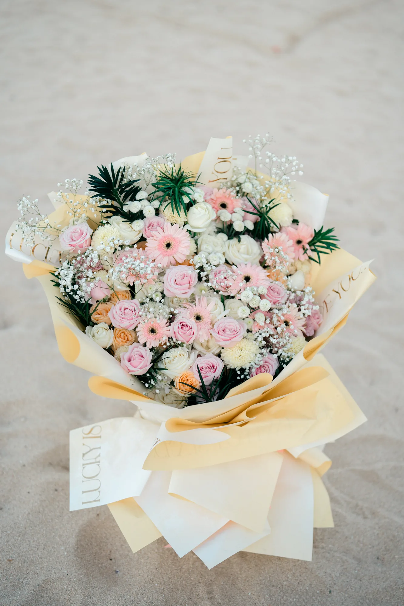 Pastel bouquet of flowers for a Bali beach proposal