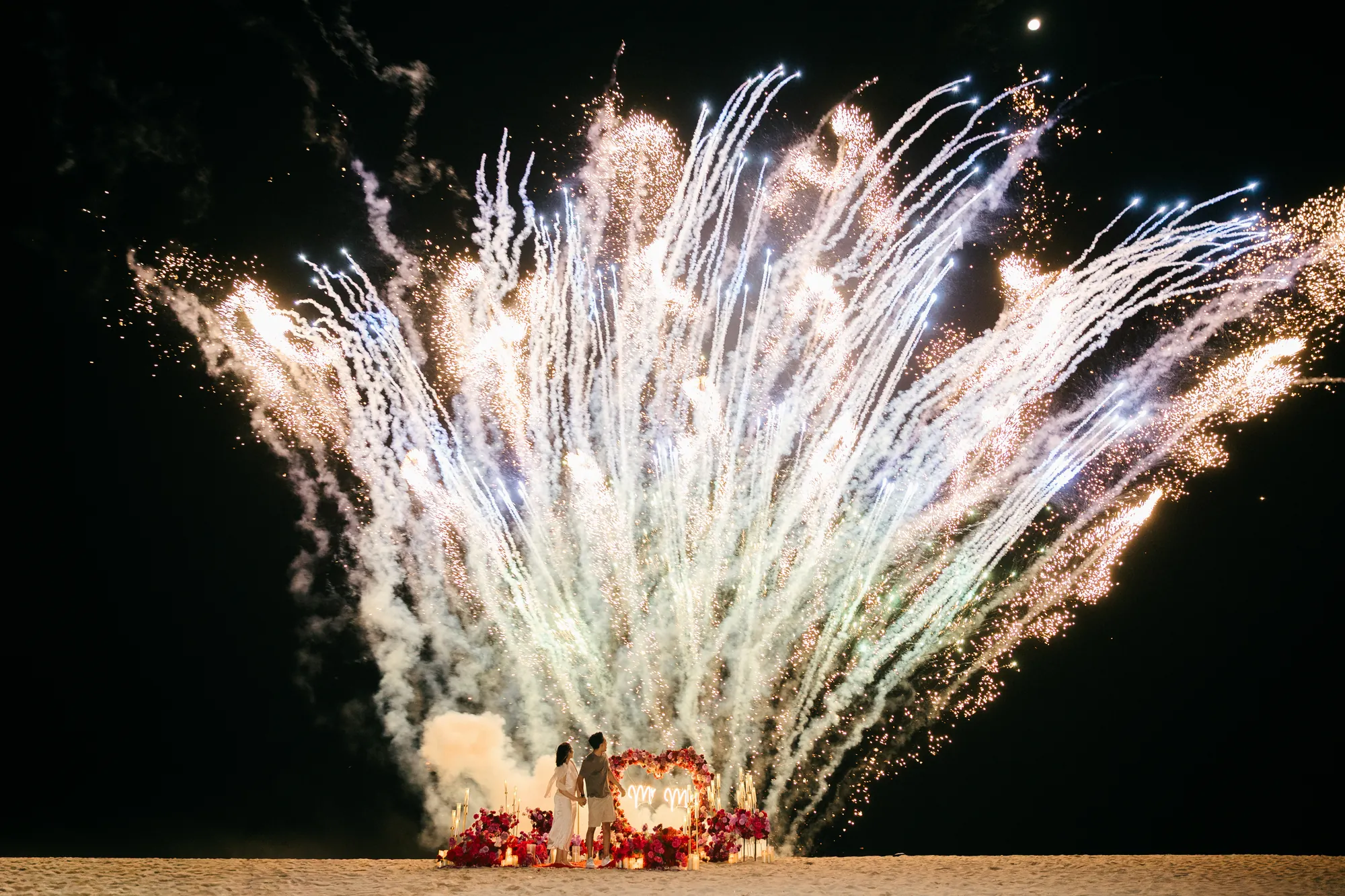 Firework finale over the ocean at a Bali beach firework proposal