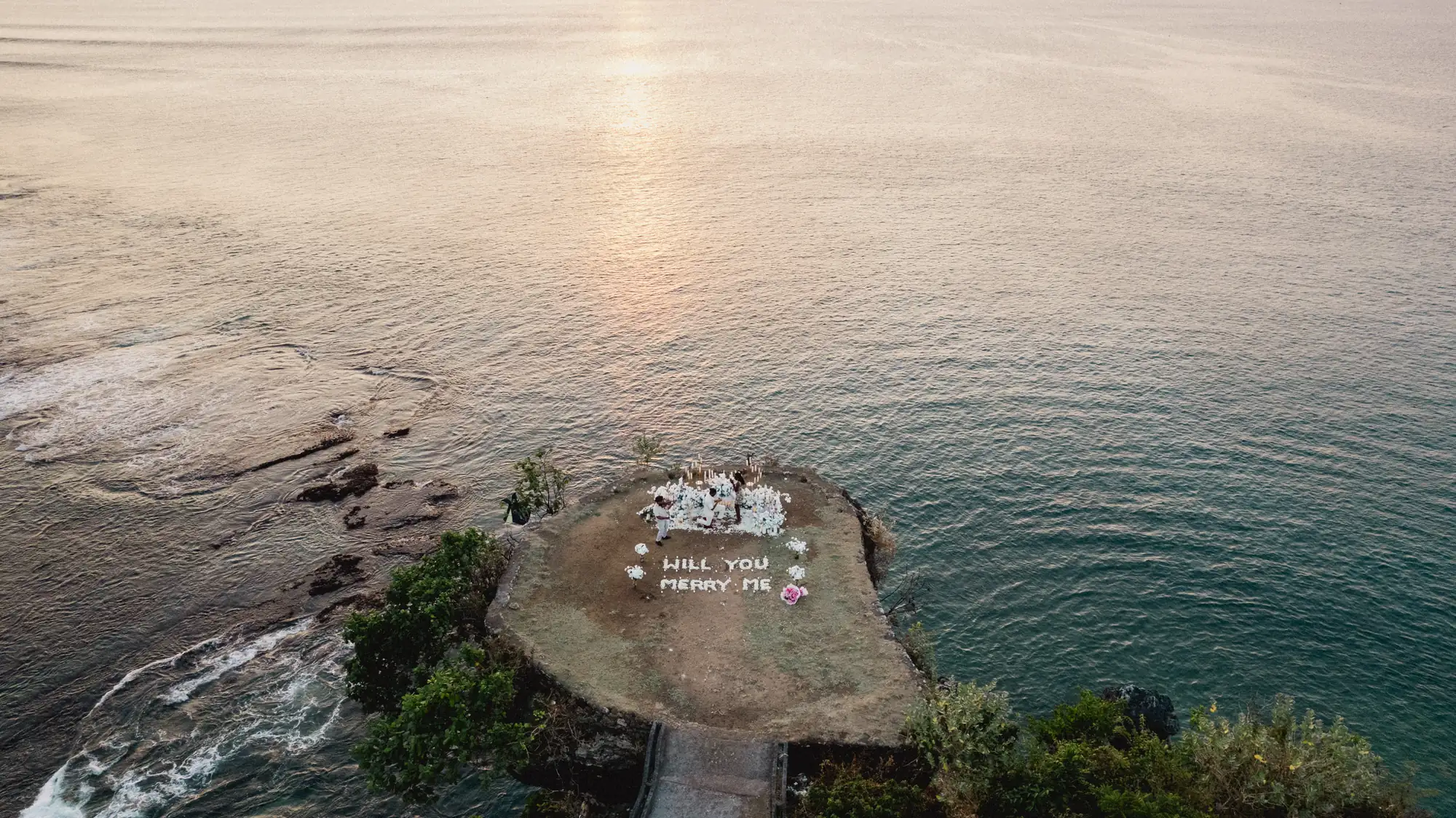 Aerial view of a Balangan clifftop proposal setup above the ocean in Bali