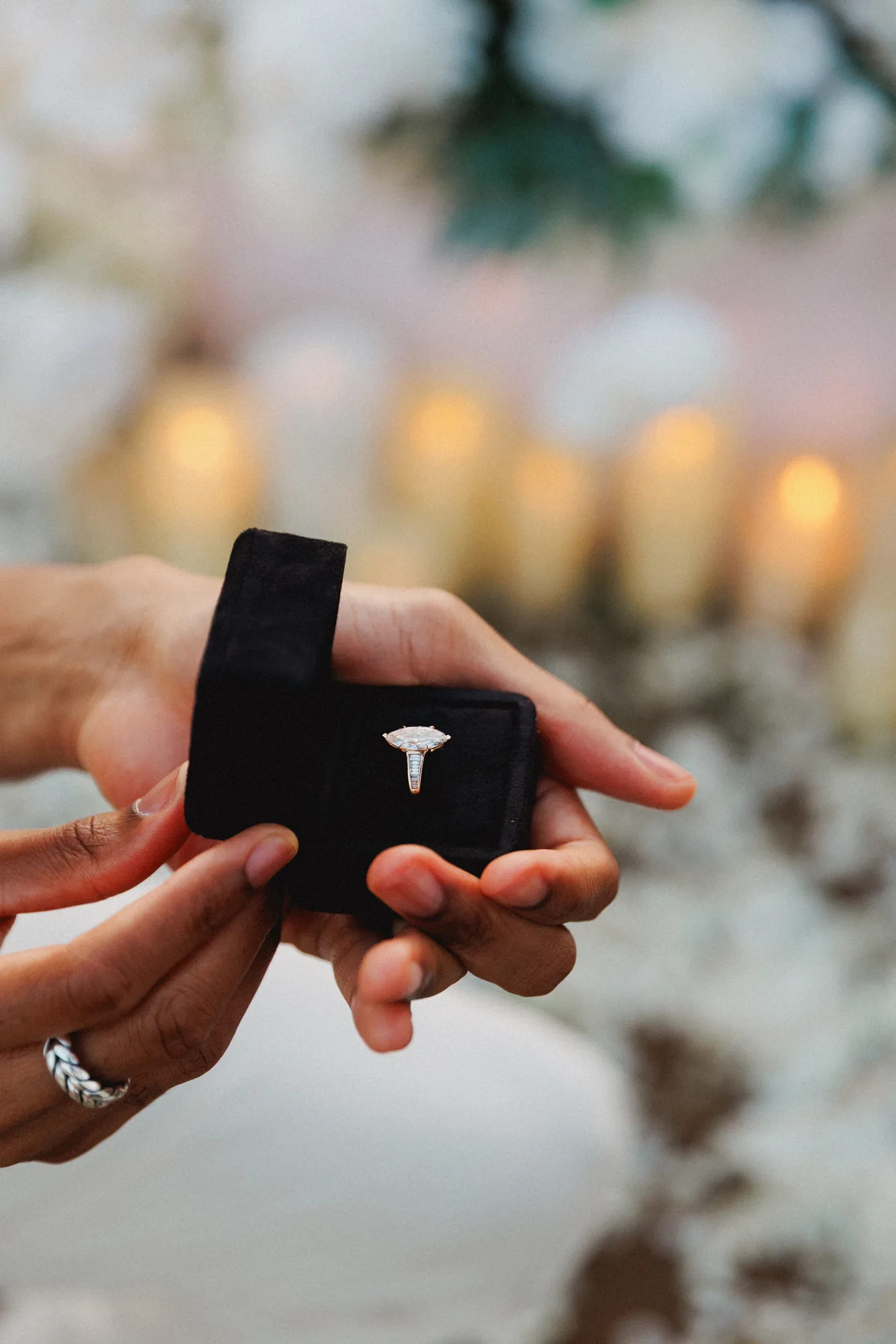 Engagement ring in a box at a Bali cliff proposal