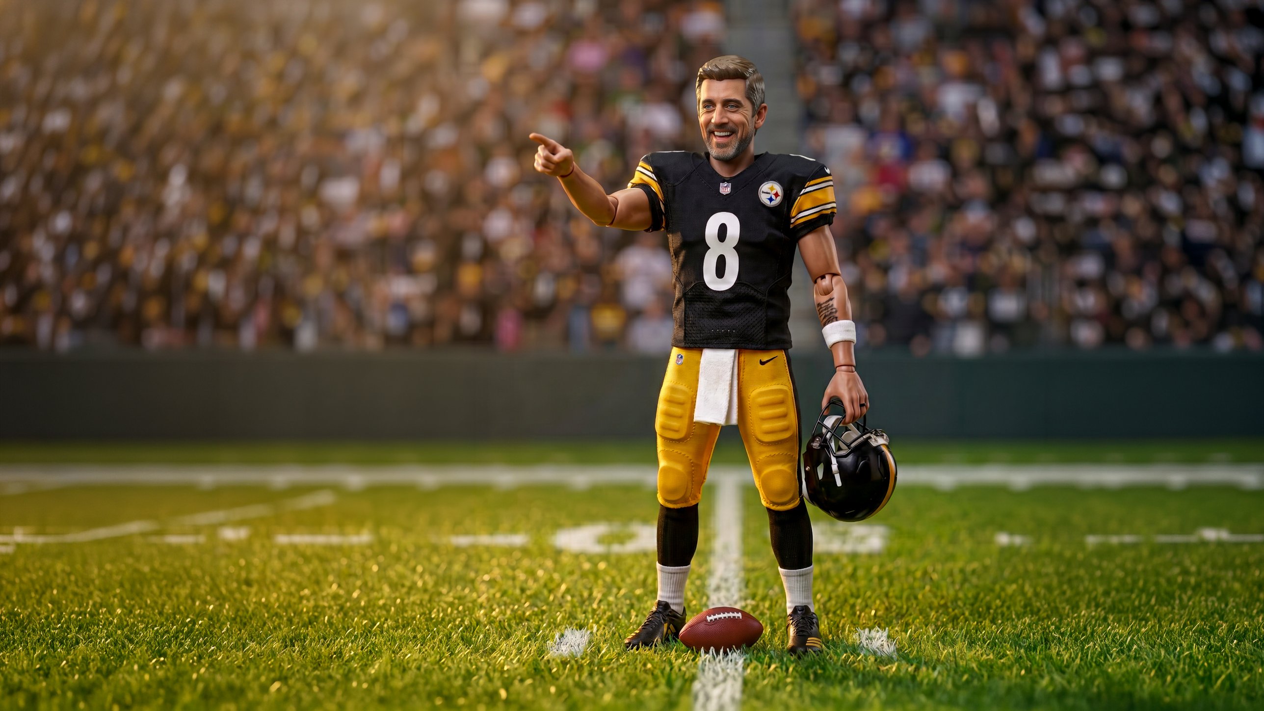 Aaron Rodgers collectible action figure in a Steelers home uniform, pointing downfield on stadium turf with his helmet in hand and a football at his feet