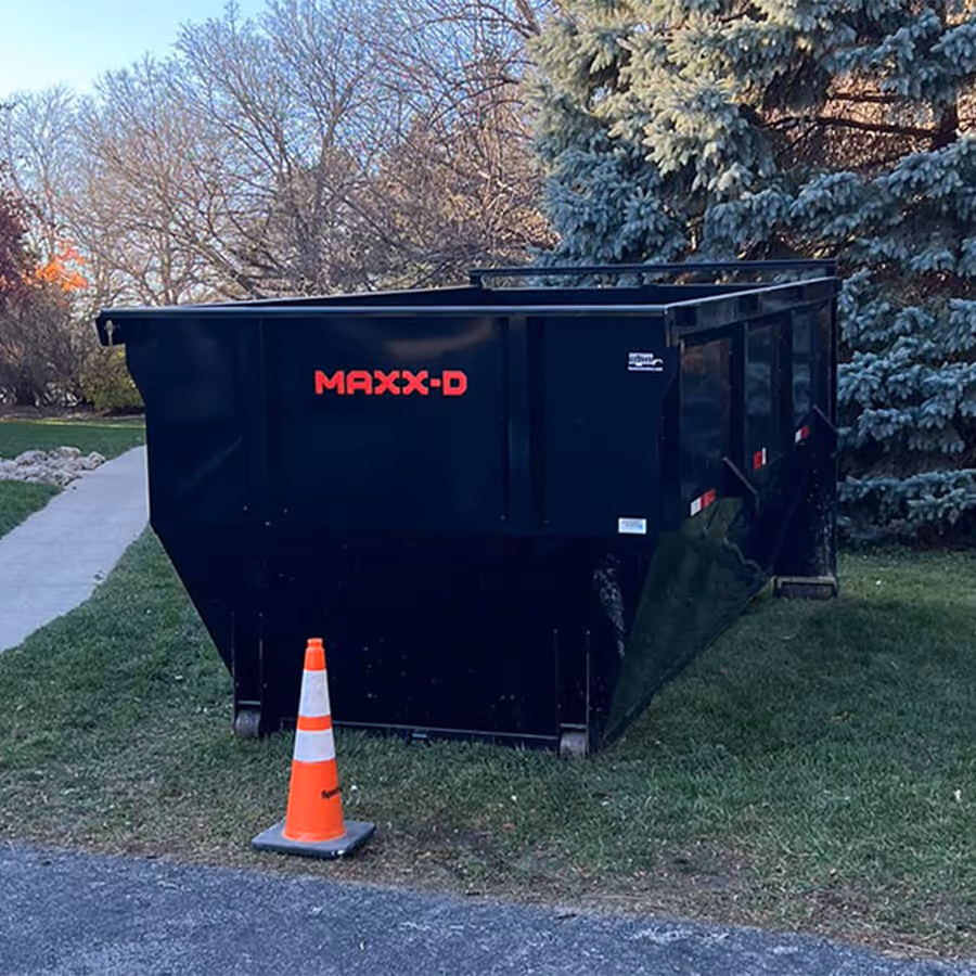 A dumpster in a yard