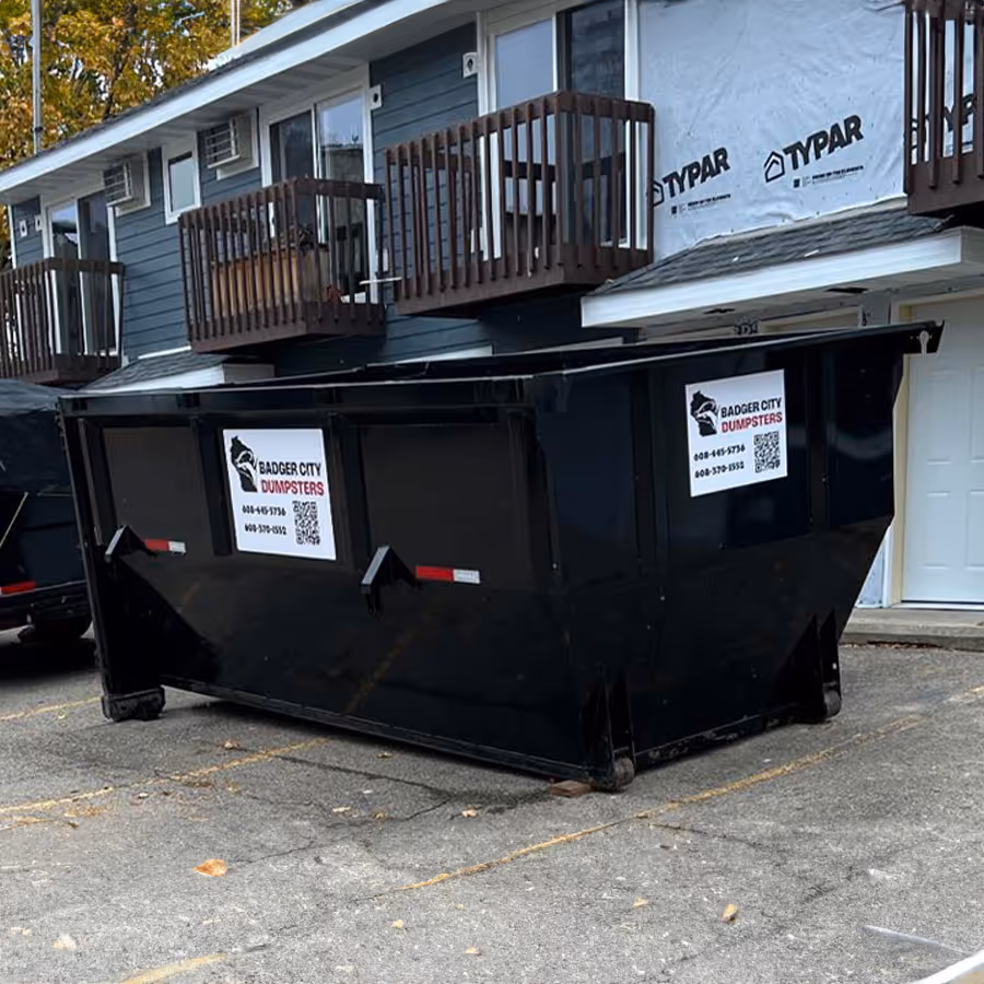 A dumpster being utilized for an apartment renovation