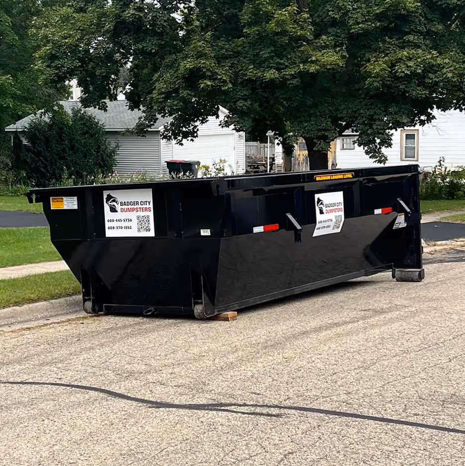 A dumpster near a house