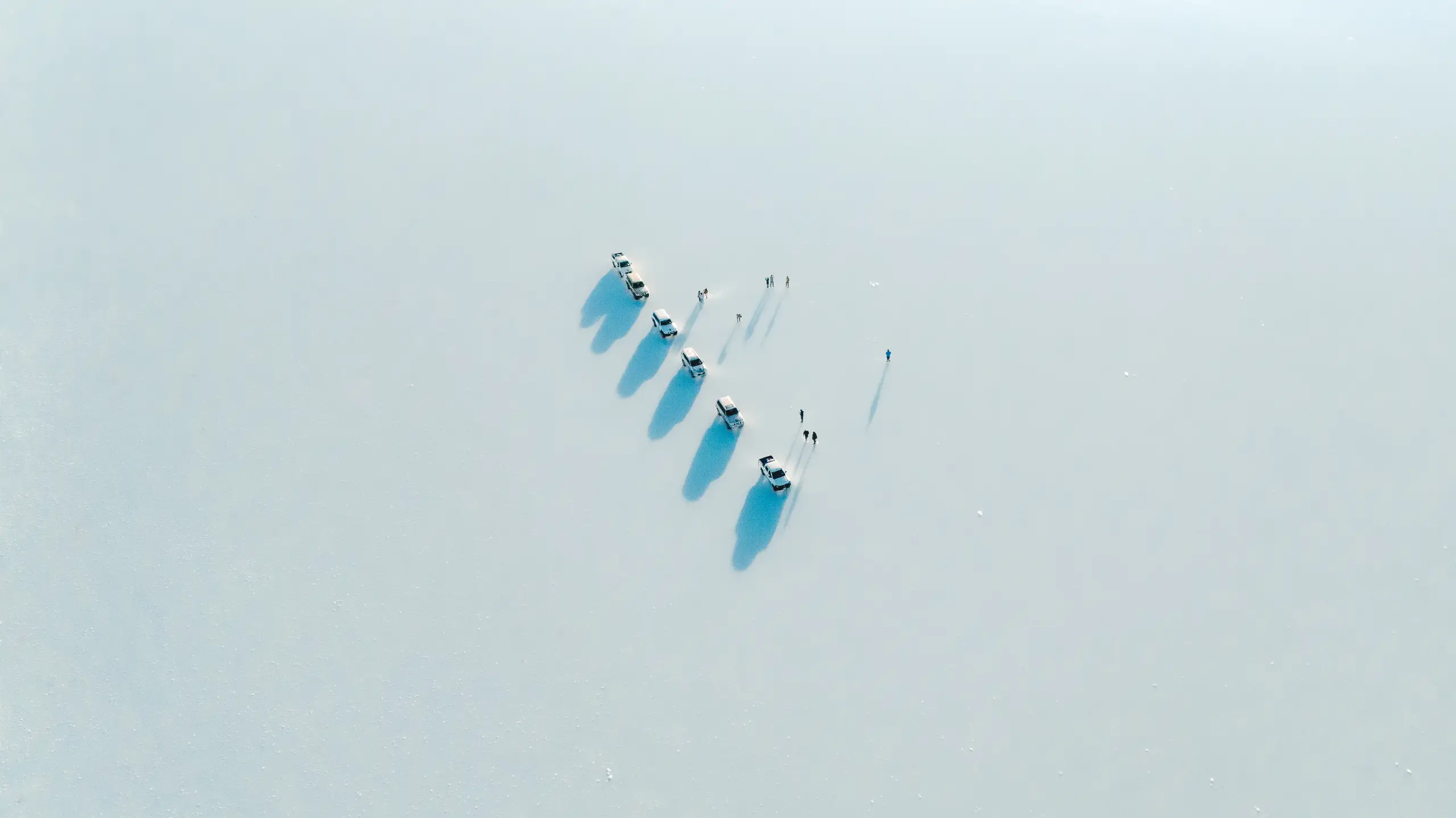 Car in the middle of ice lake