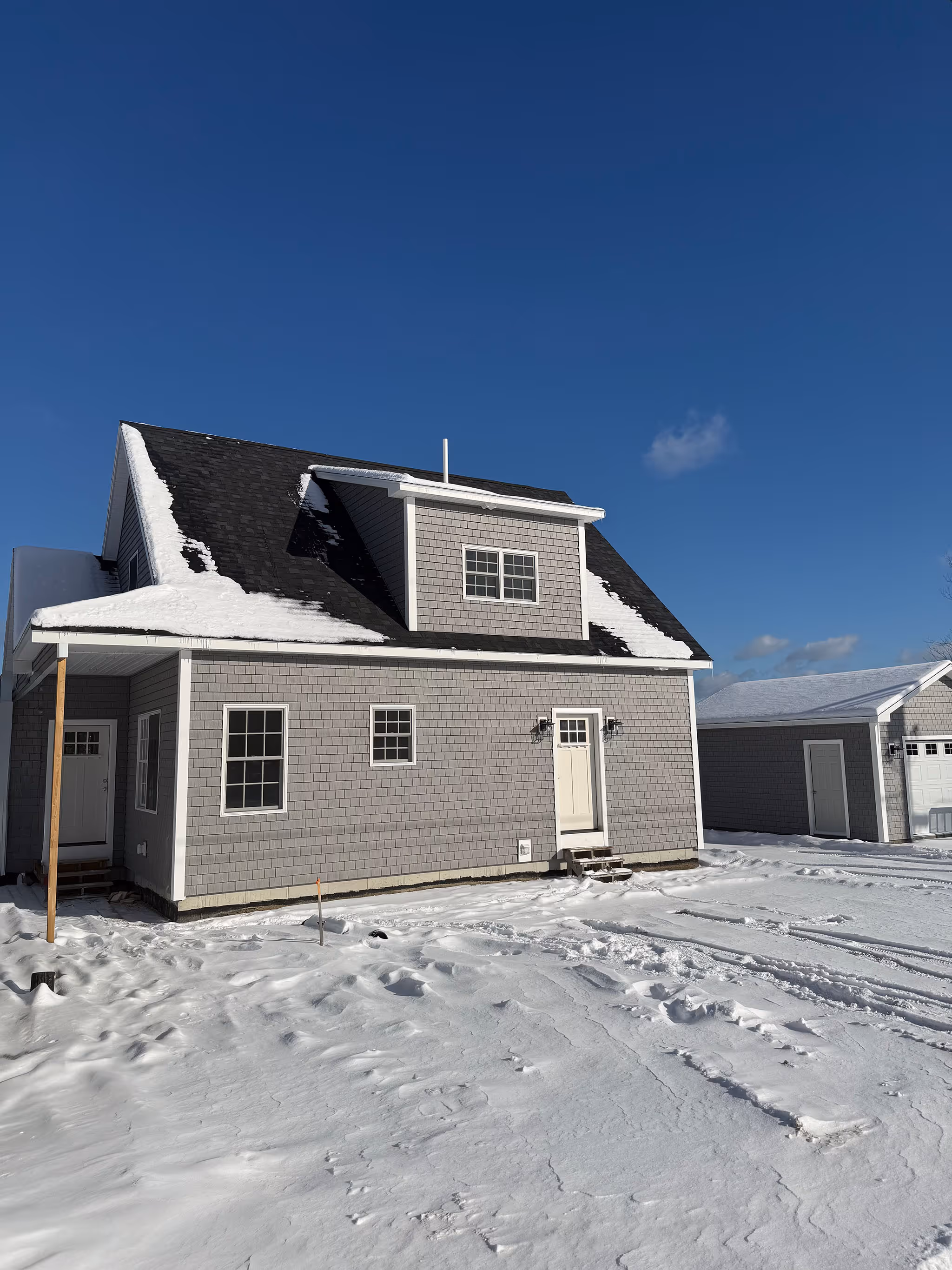 cape style duplex home in maine