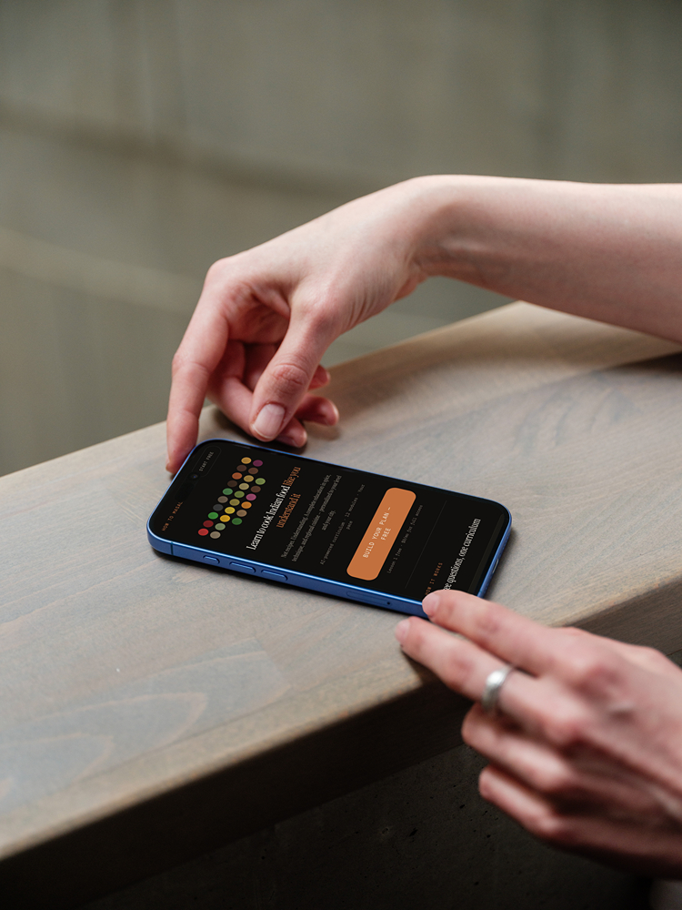 HowToMasala mobile view on iPhone 16 wooden surface