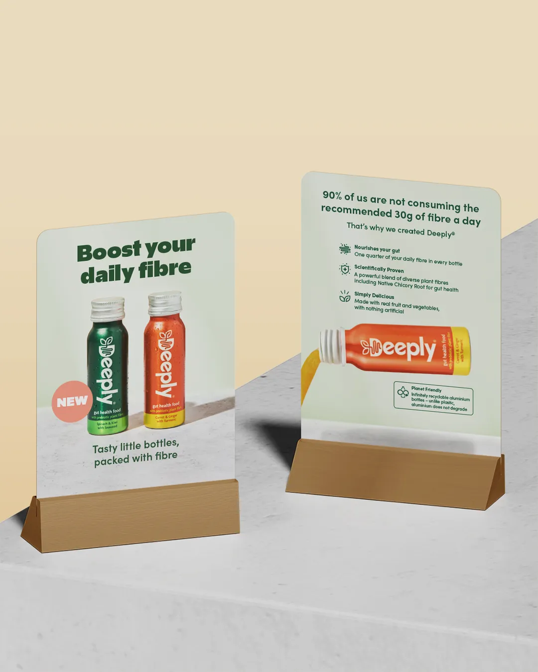 Front and back views of tabletop poster design for Deeply prebiotic drink