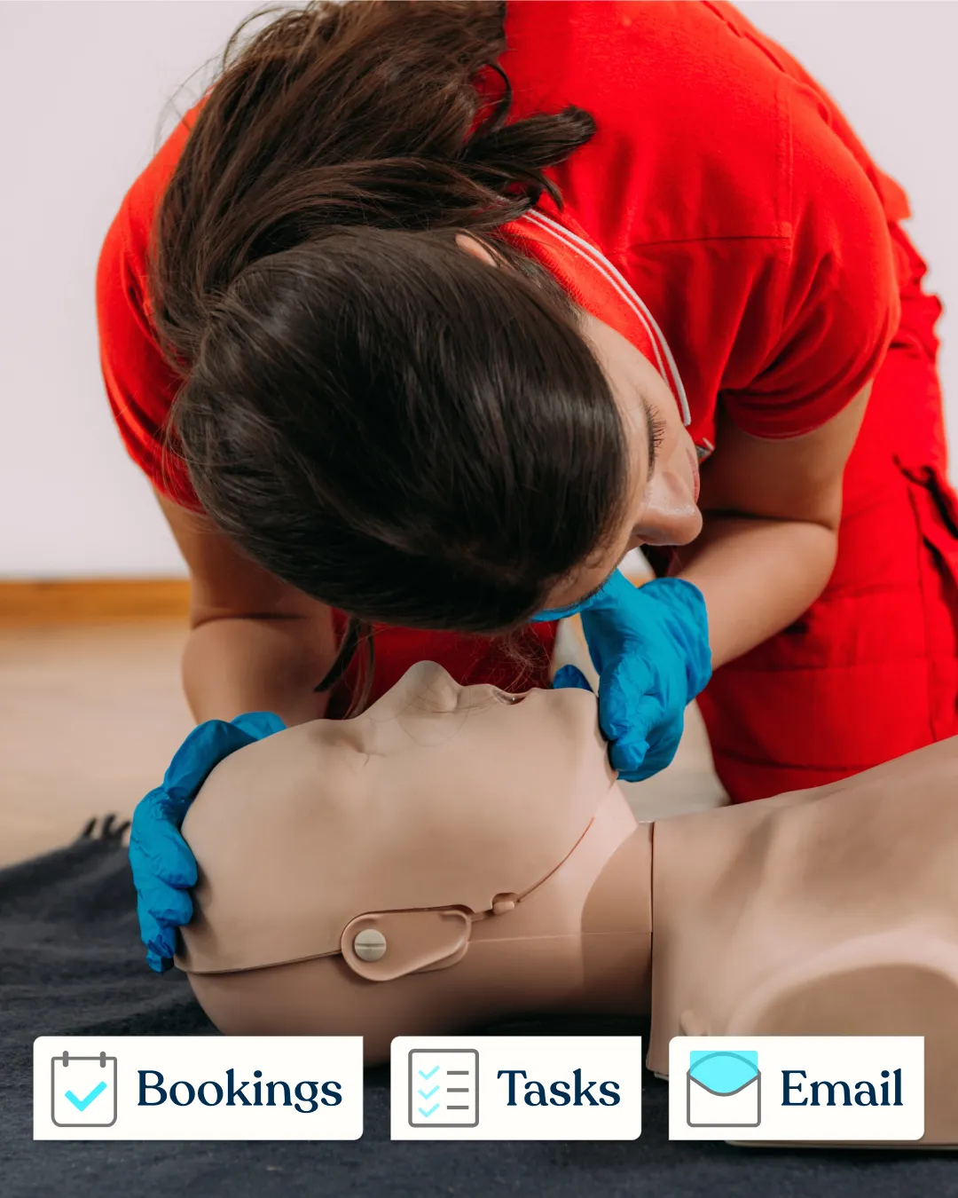 Woman giving first aid training on a dummy with UI graphics overlay showing “Bookings, Tasks, Email” for AideCRM CRM software