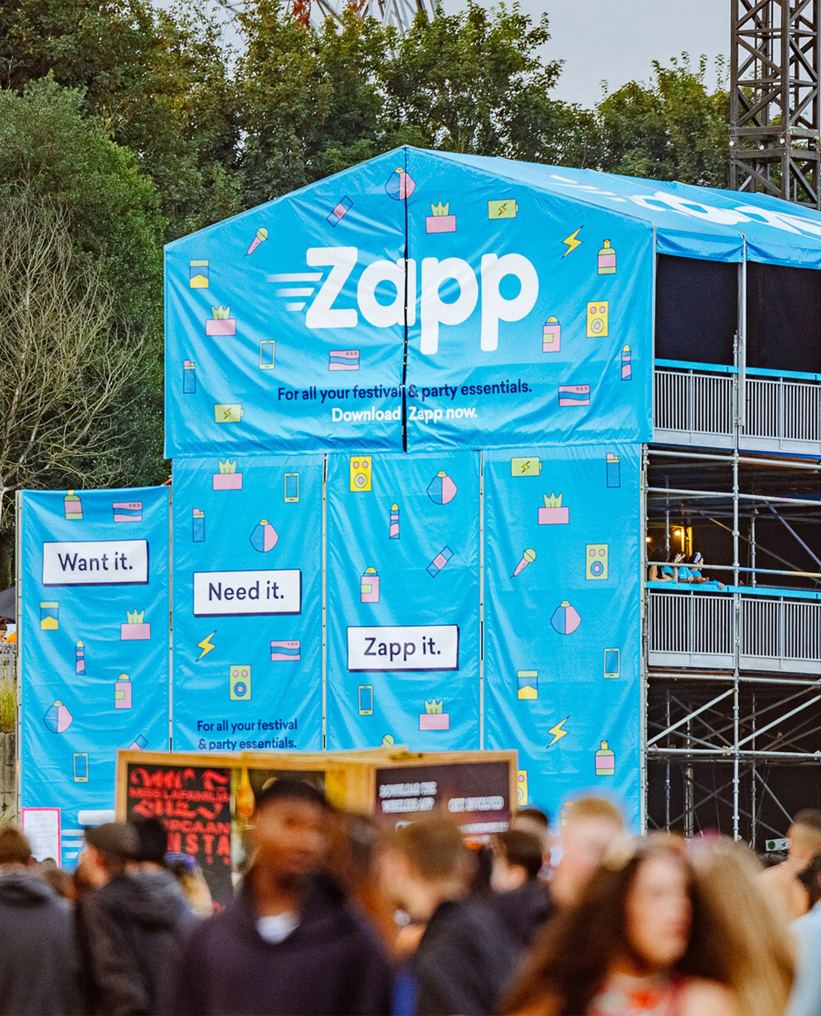 Zapp festival viewing platform ad designed for high-traffic outdoor visibility, part of a wider OOH campaign targeting event-goers with bold messaging from the e-commerce startup.
