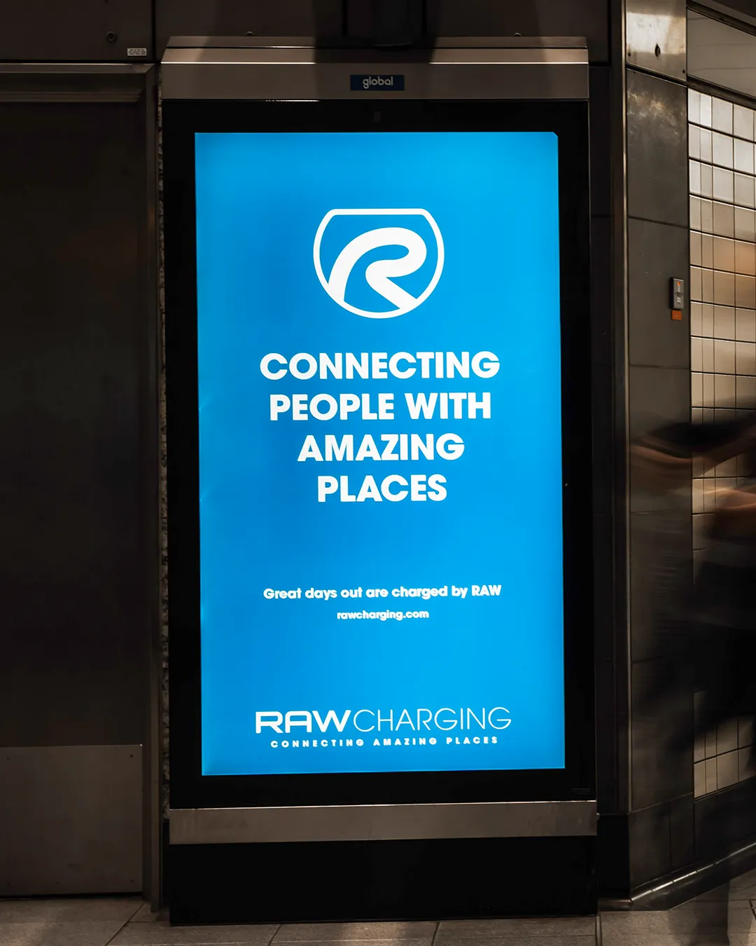 RAW Charging out-of-home poster at King's Cross tube station encouraging EV adoption
