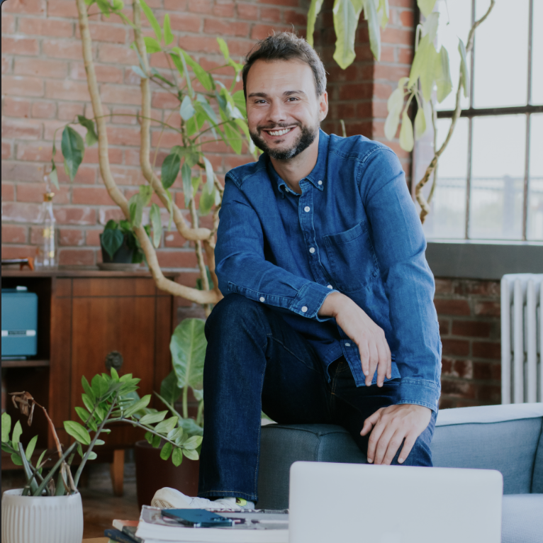 Smiling Toronto real estate agent in a bright loft
