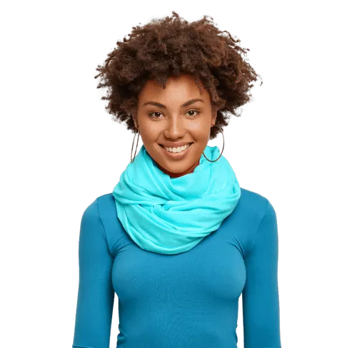 A friendly woman wearing turquoise, smiling