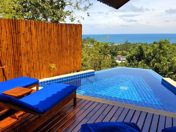 the private pool and balcony with view over the ocean from a resort in koh tao