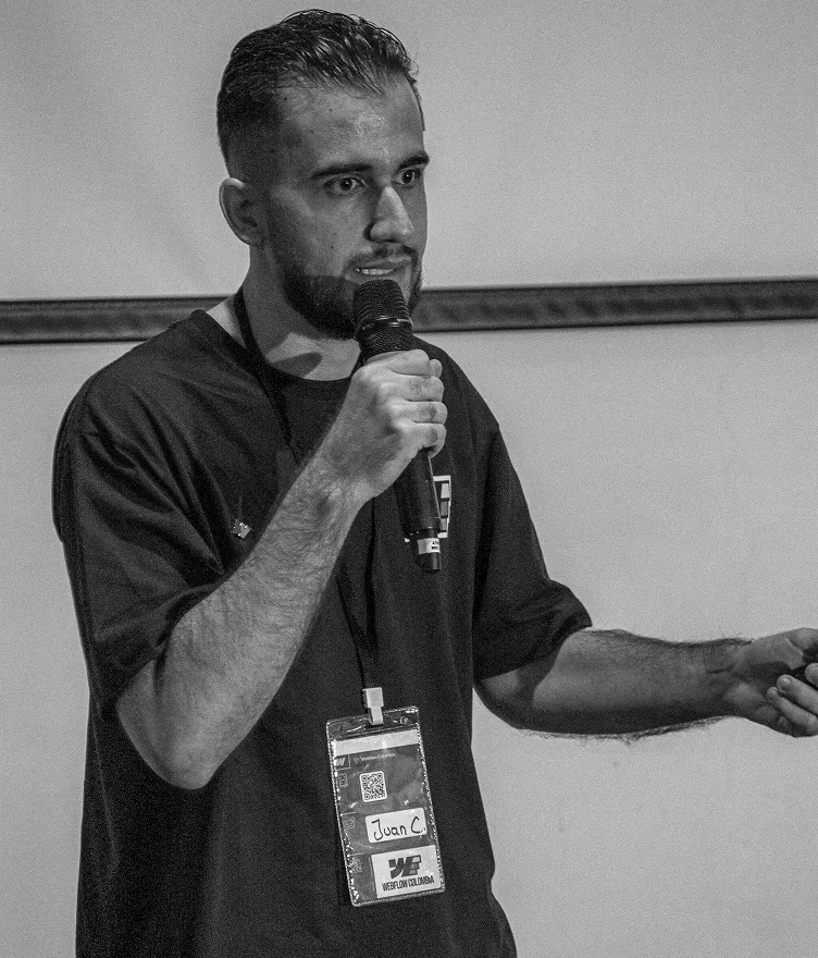 Juan Mac speaking at Webflow Colombia event, sharing insights about web design and creative process