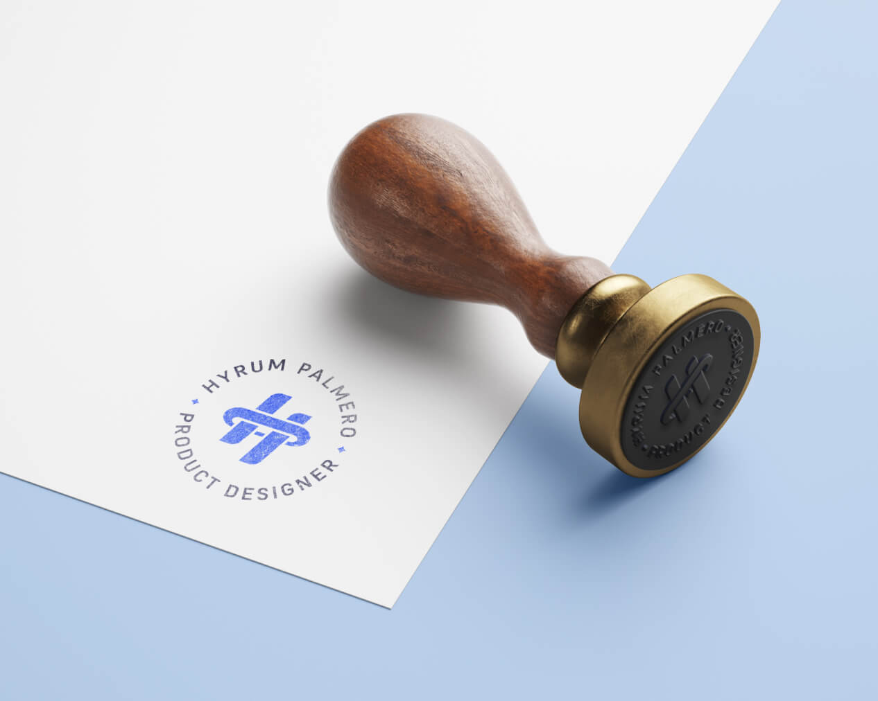 Logo design for Hyrum Palmero, Product Designer, displayed on a wooden stamp mockup with blue ink seal