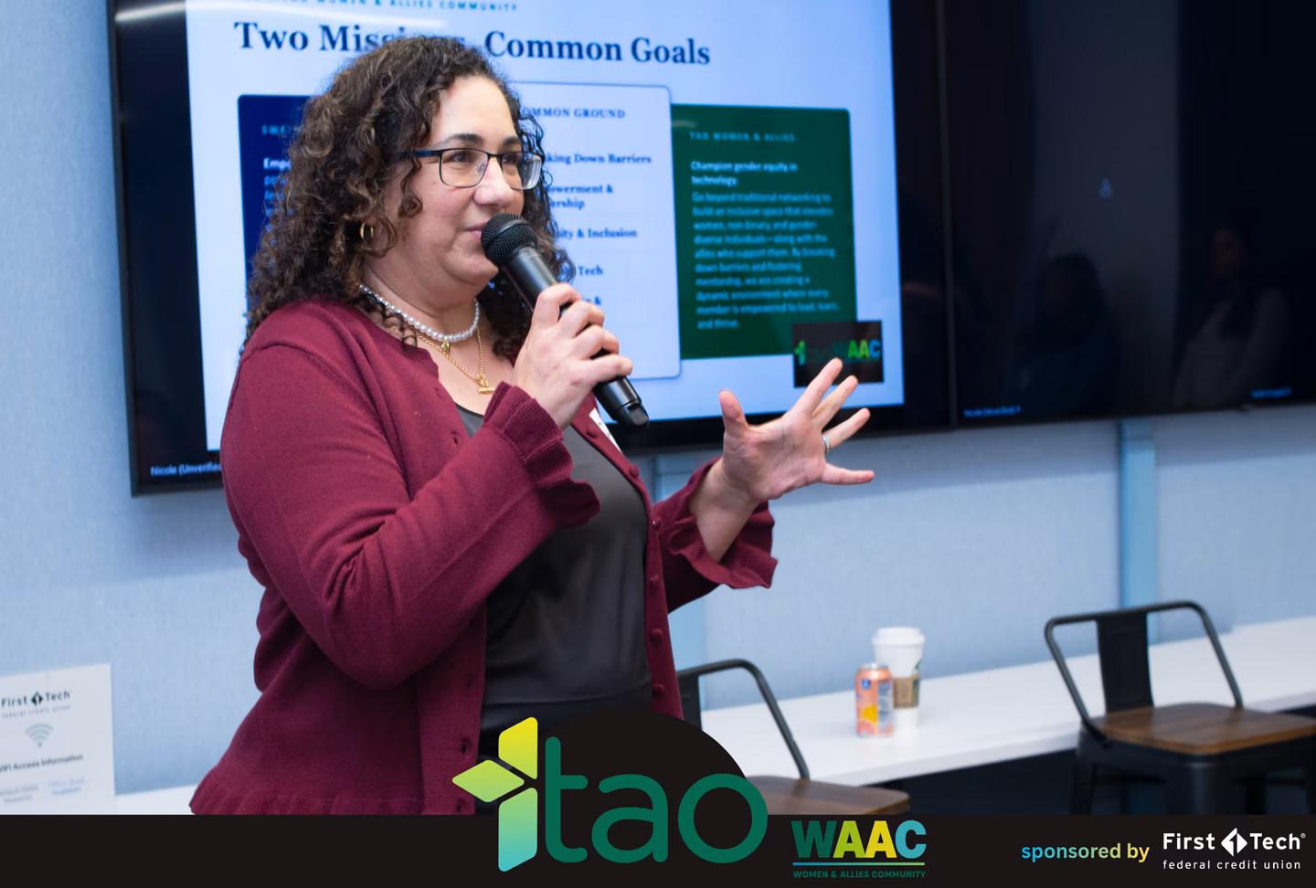 WAAC co-chair speaking in front of a Two Missions, Common Goals slide about WAAC and SWE