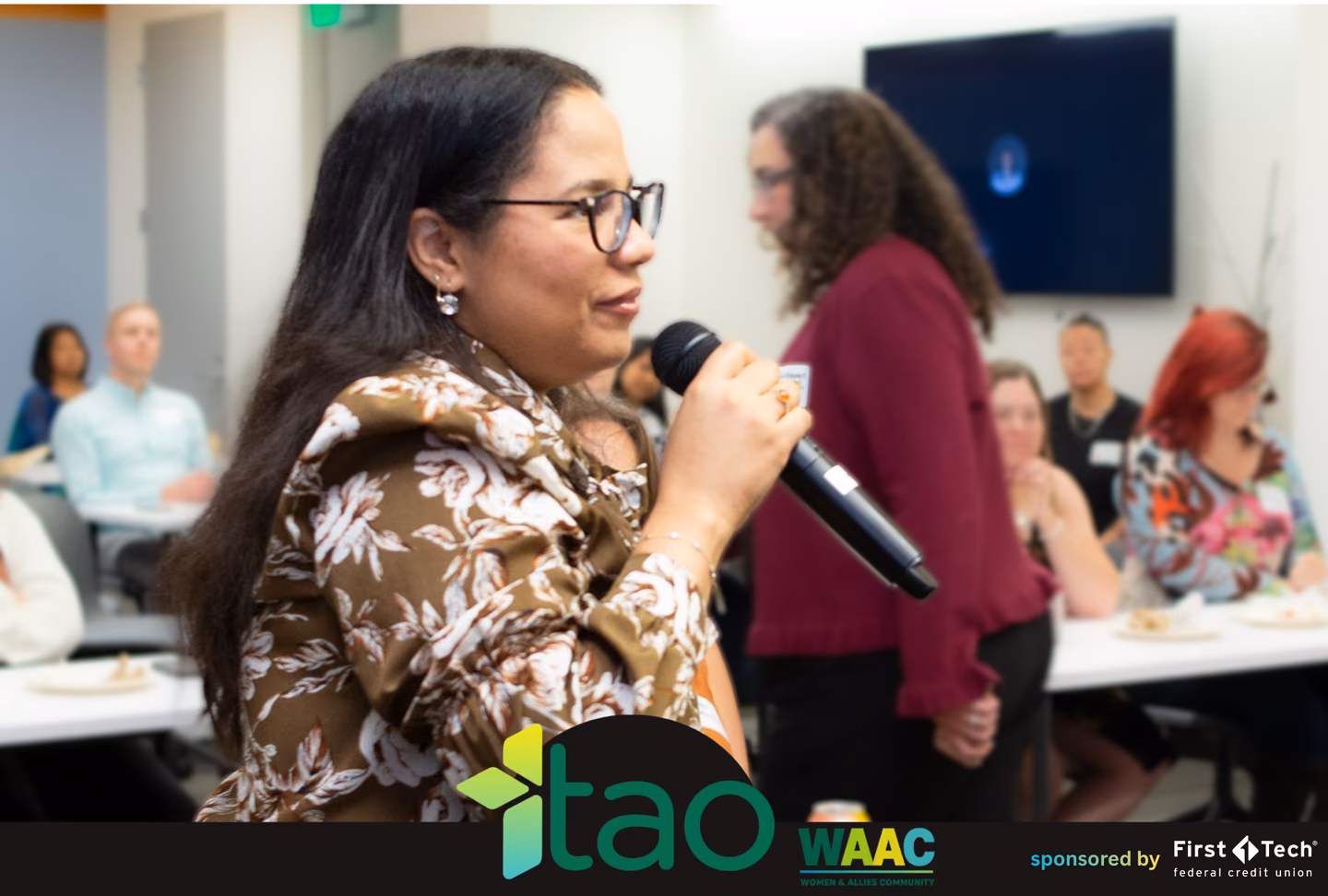 Attendee asking the panel a question during the audience Q&A