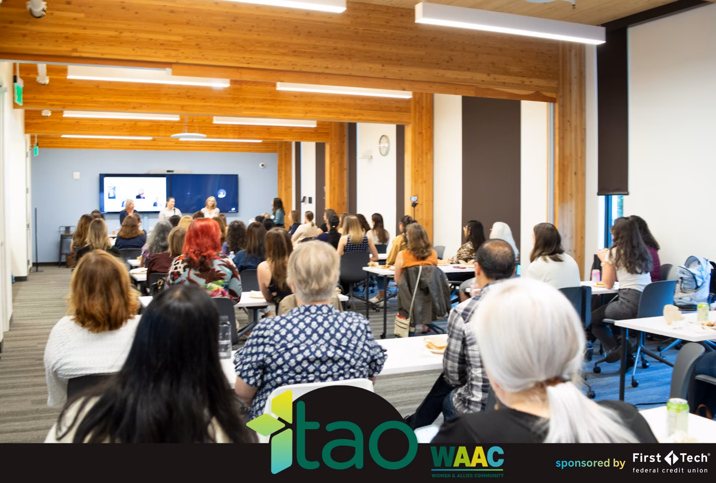 Full room of attendees listening to the panel at the TAO WAAC and SWE event