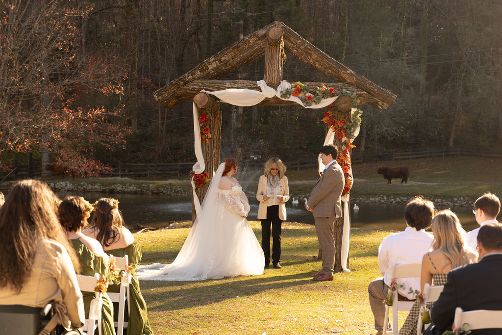Bride with horse and carriage at Satolah Creek Farm wedding venue in North Gerogia