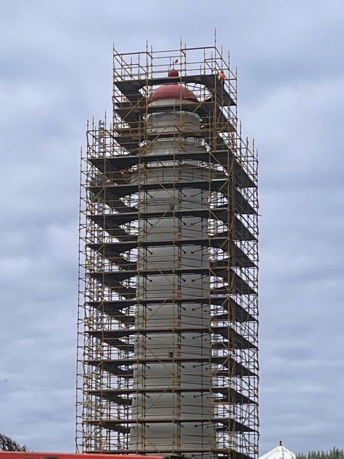 A lighthouse with scaffolding designed and engineered to withstand the extremely high winds encountered at Cape Nelson