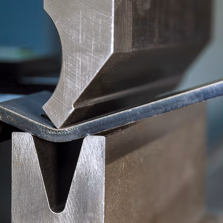 Extreme close up of a Press brake bending steel plate
