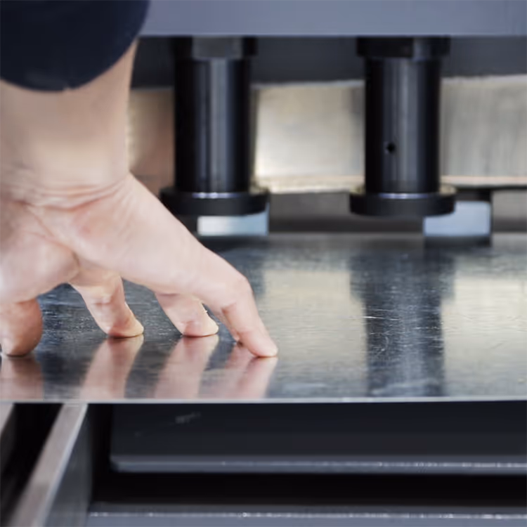 Close up action shot of a metal guillotine cutting sheet metal
