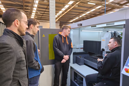 A close-up of a water jet cutting head