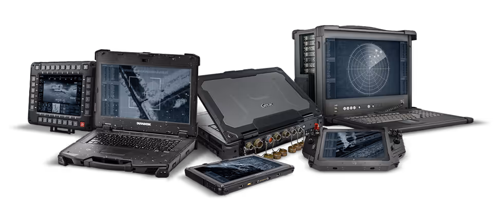 Various rugged military-grade electronic devices including laptops, tablets, and a radar display with tactical screens.