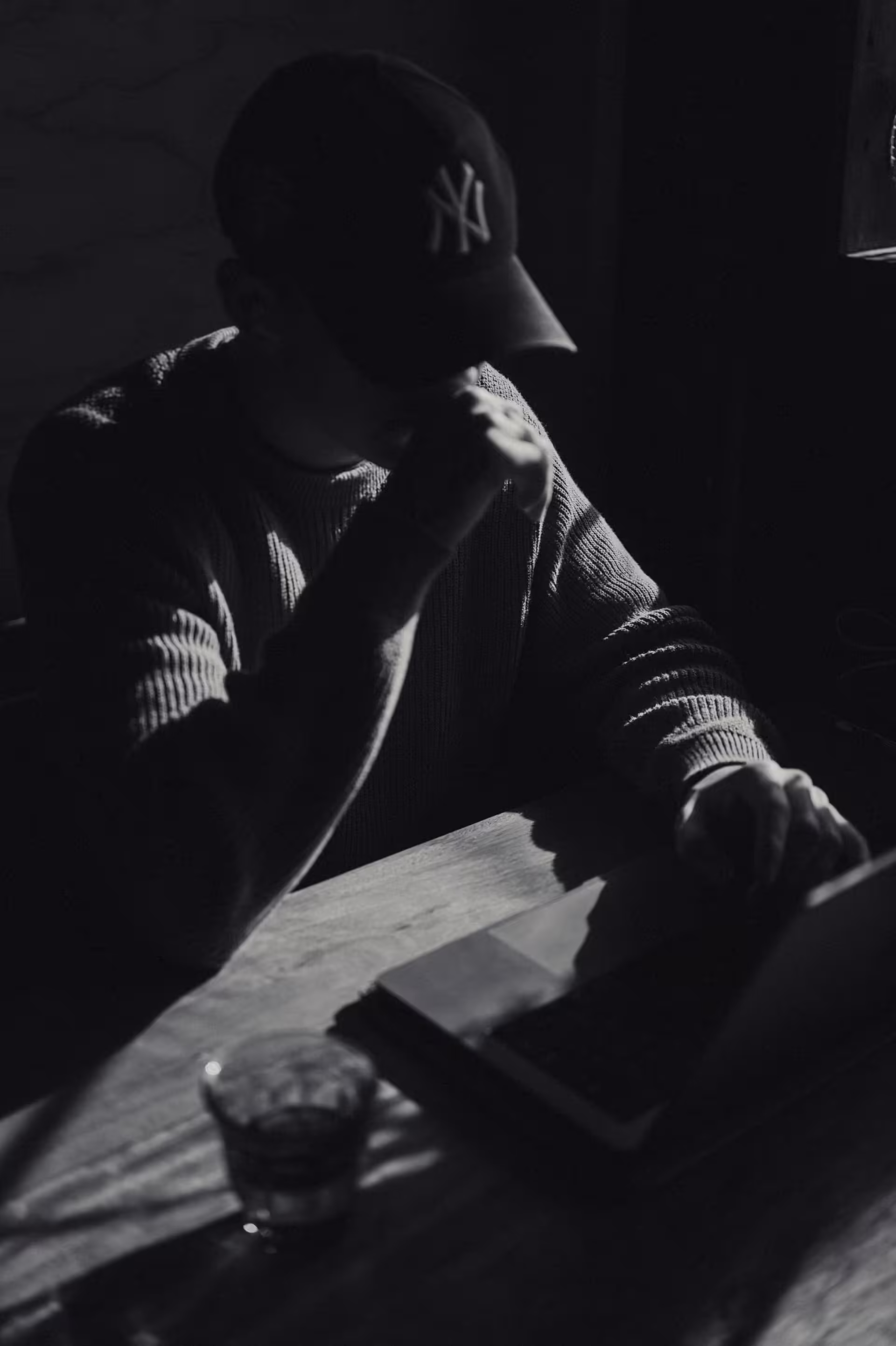 a man sitting at a desk with a laptop