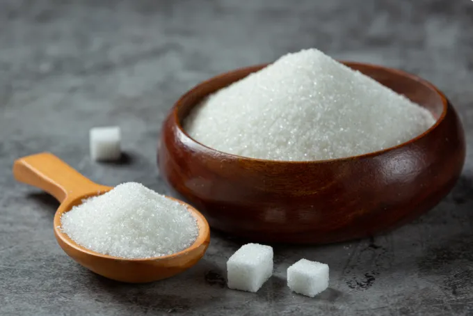 A bowl filled with Ukrainian-made sugar, promoting local products