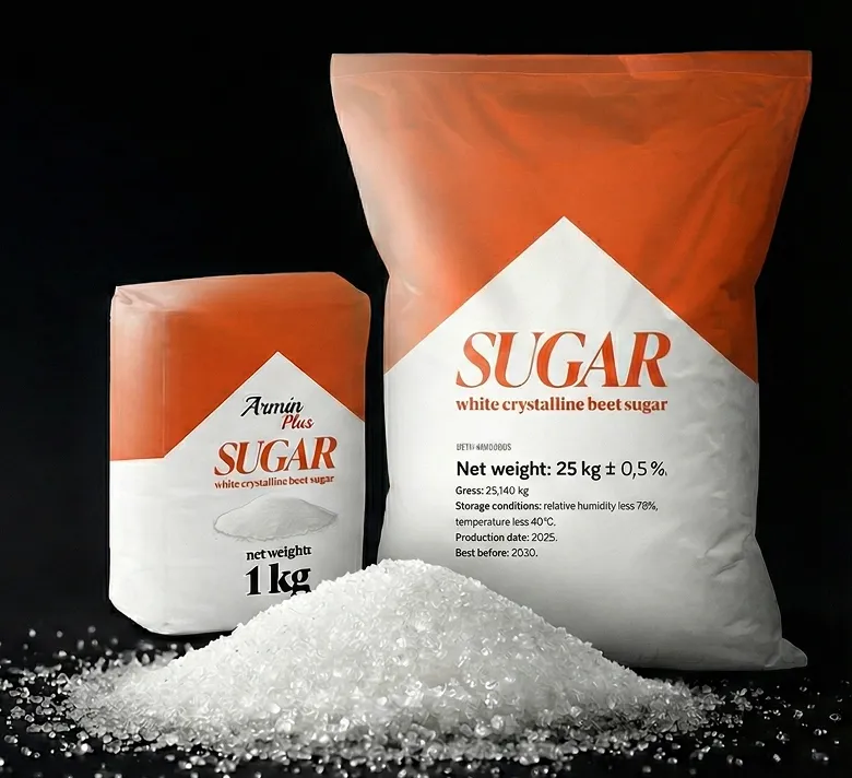 Two bags of white crystalline beet sugar with orange and white packaging, one 1 kg and one 25 kg, displayed behind a mound of sugar crystals on a black background.