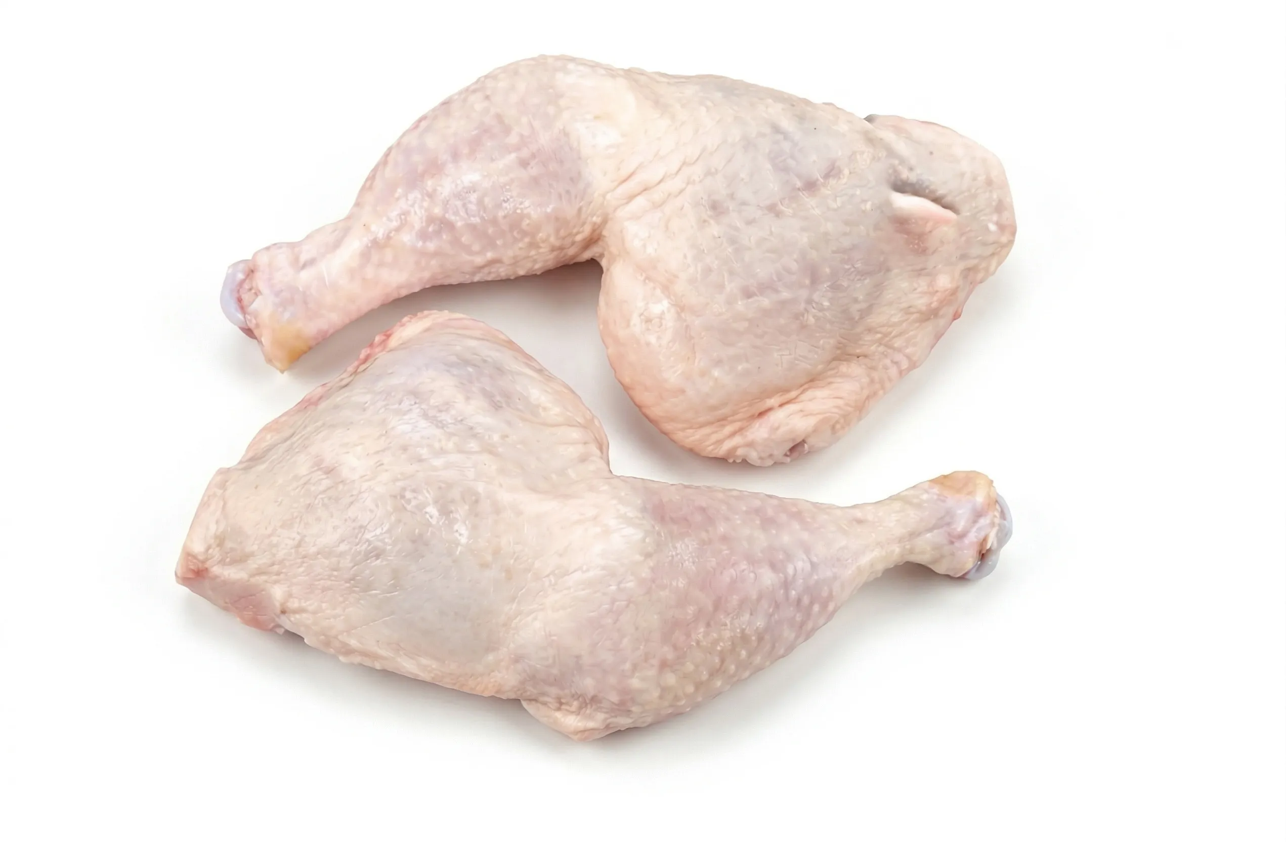 Two raw Armin Plus chicken leg quarters with skin on a white background.