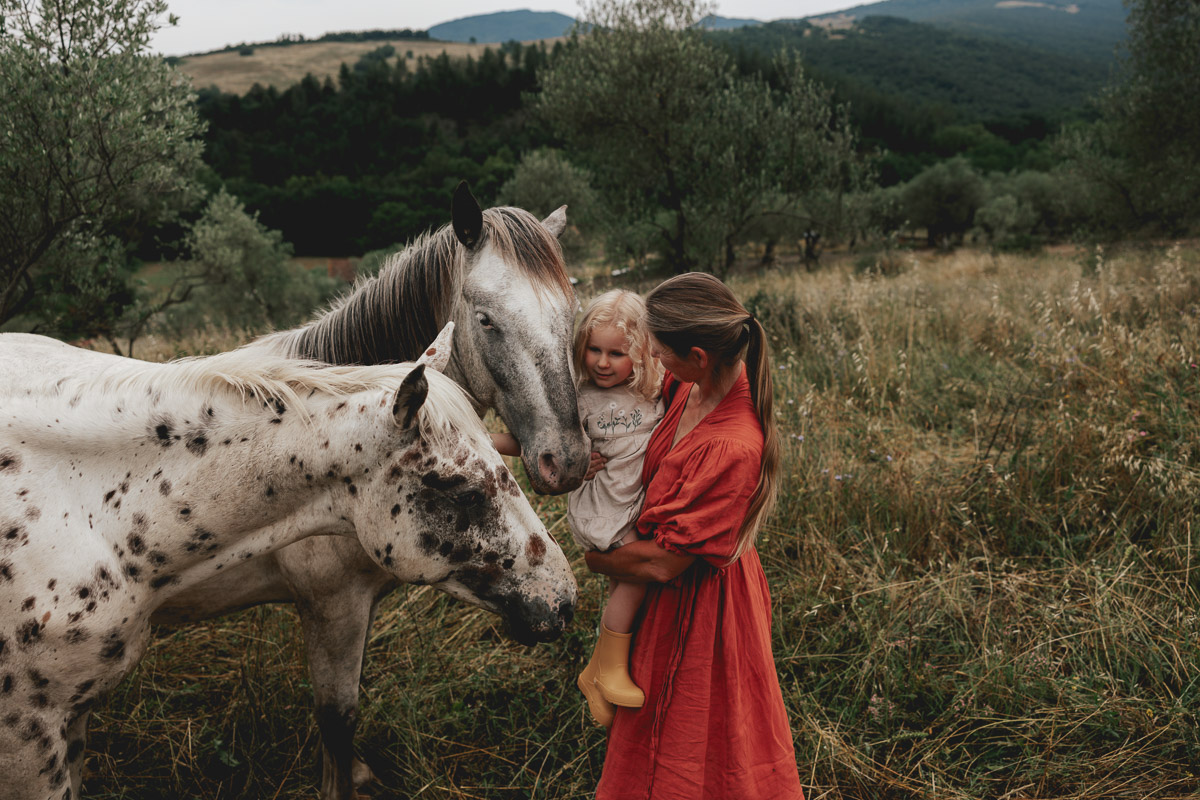 mother and daughter and their horses