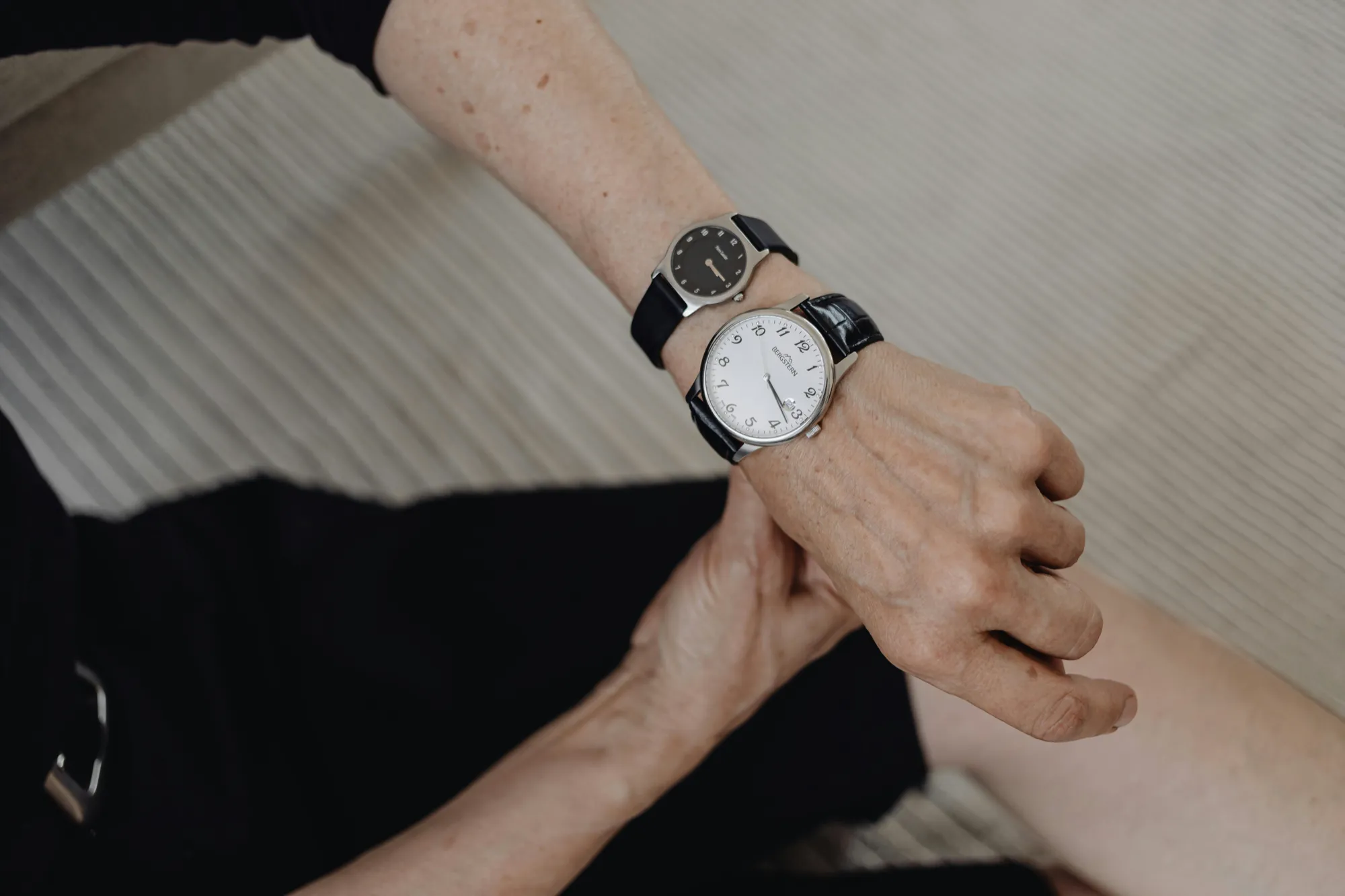 A woman wearing a wristwatch, symbolizing the importance of time in estate settlement processes.