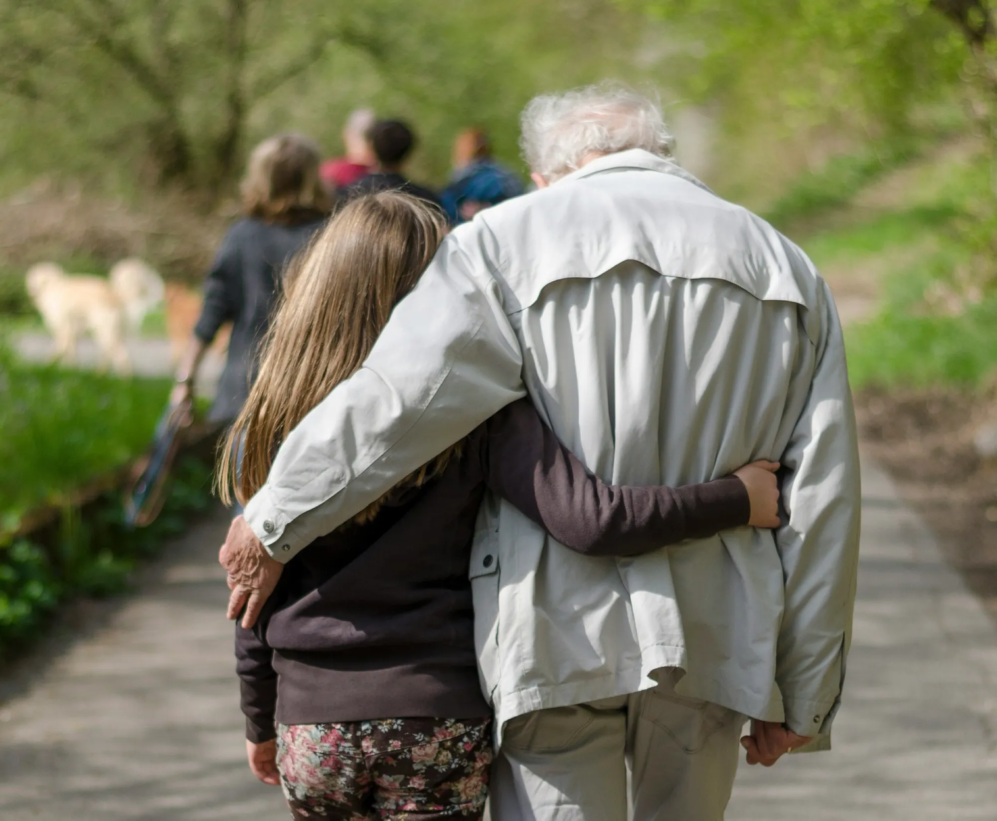grandparent and grandchild walk together