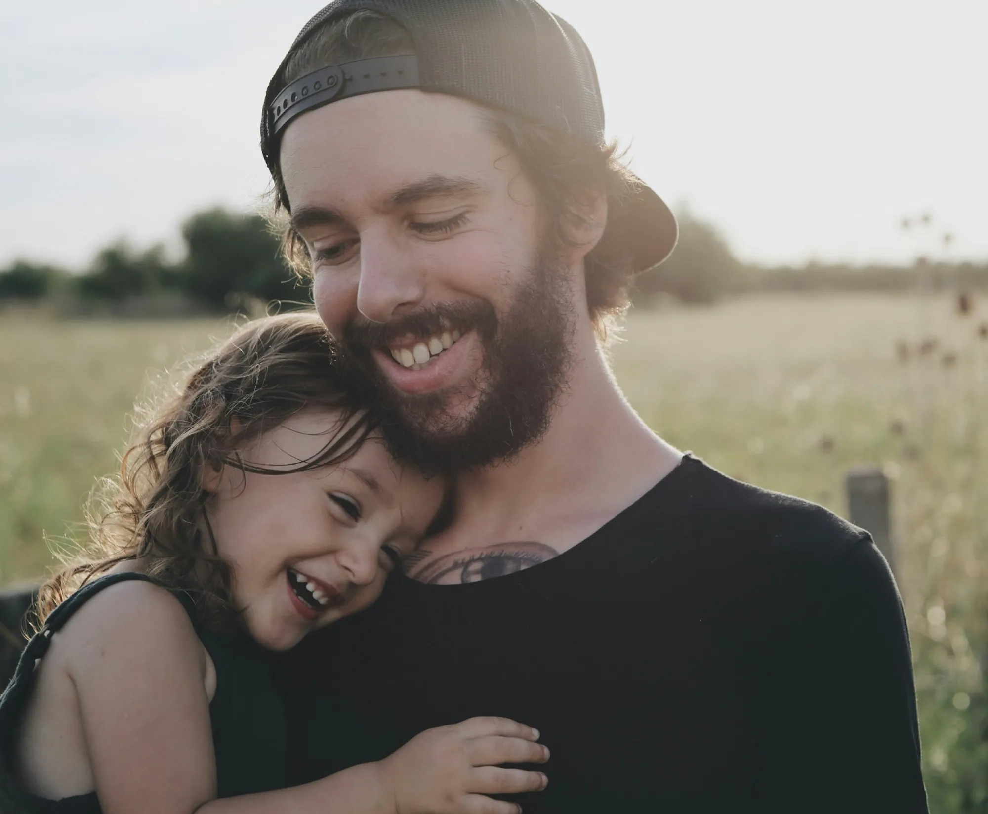 Father and daughter smiling