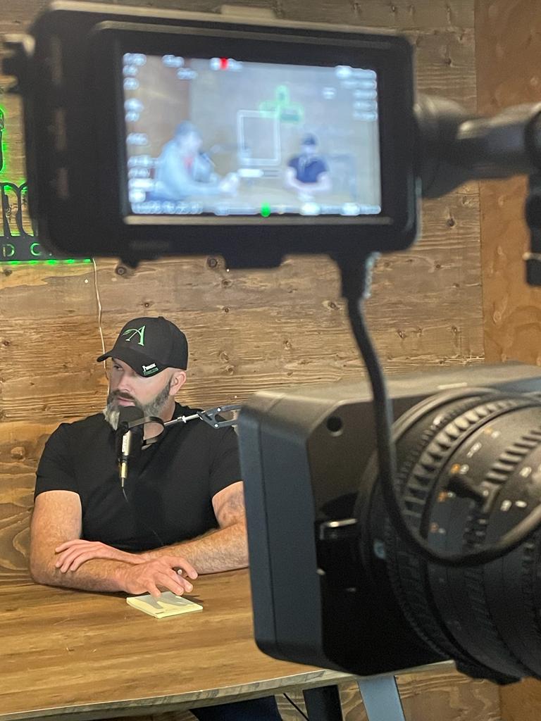 man behind camera
