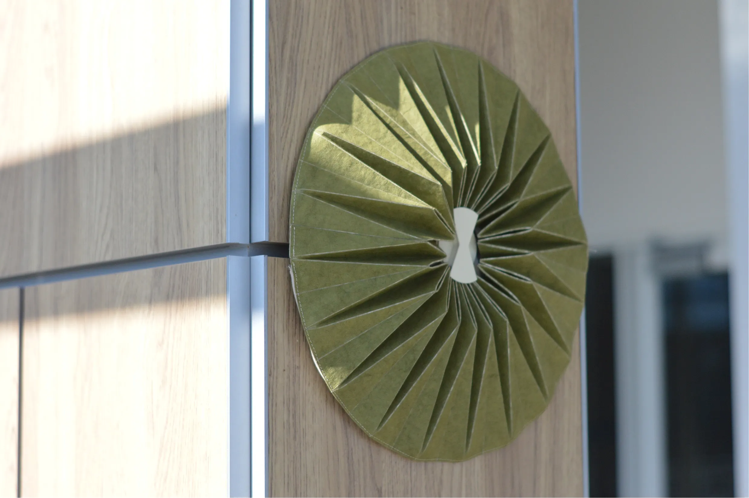 Enfold folded flat on the wall