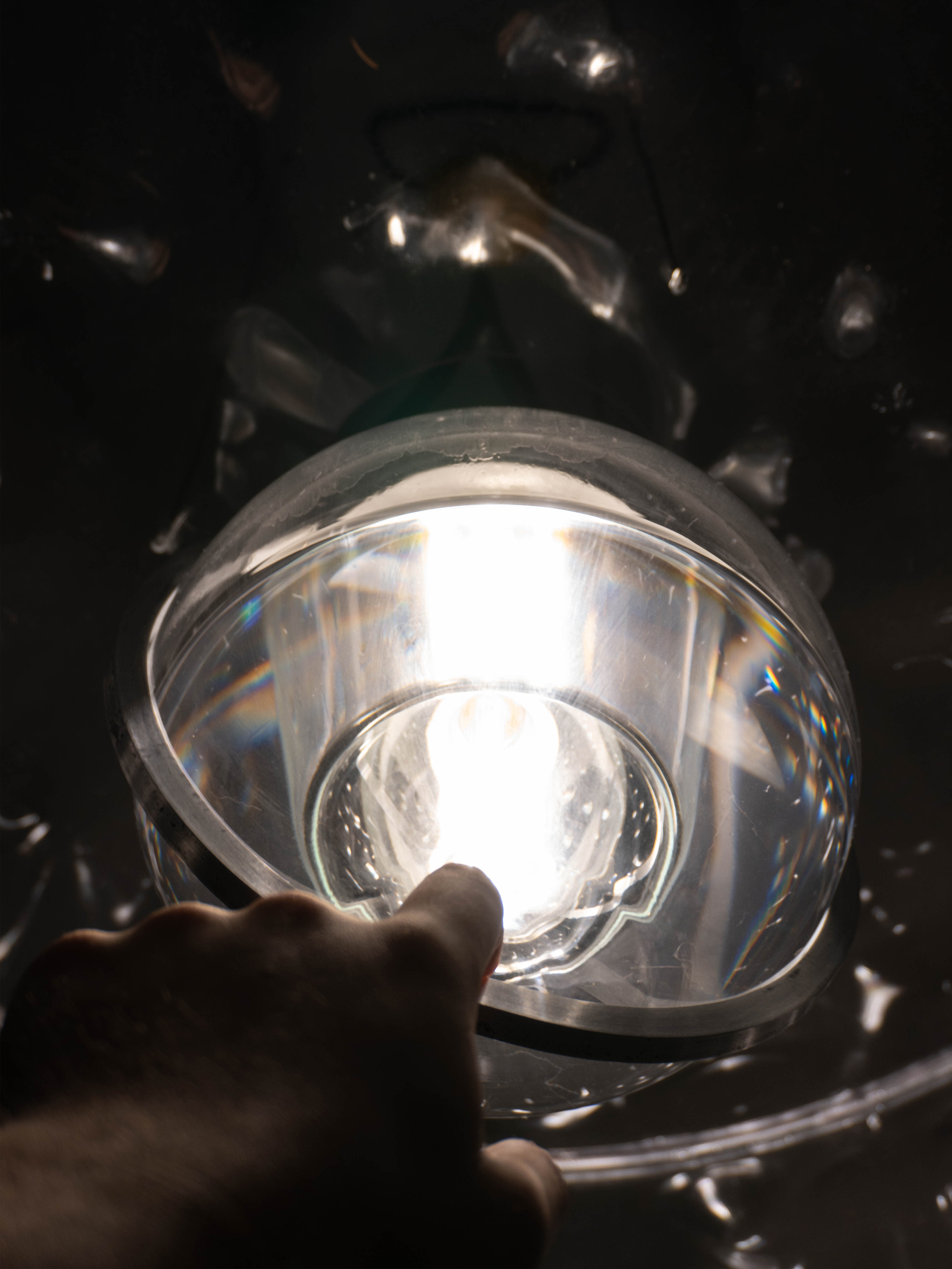 Pushing the handle under the bulb