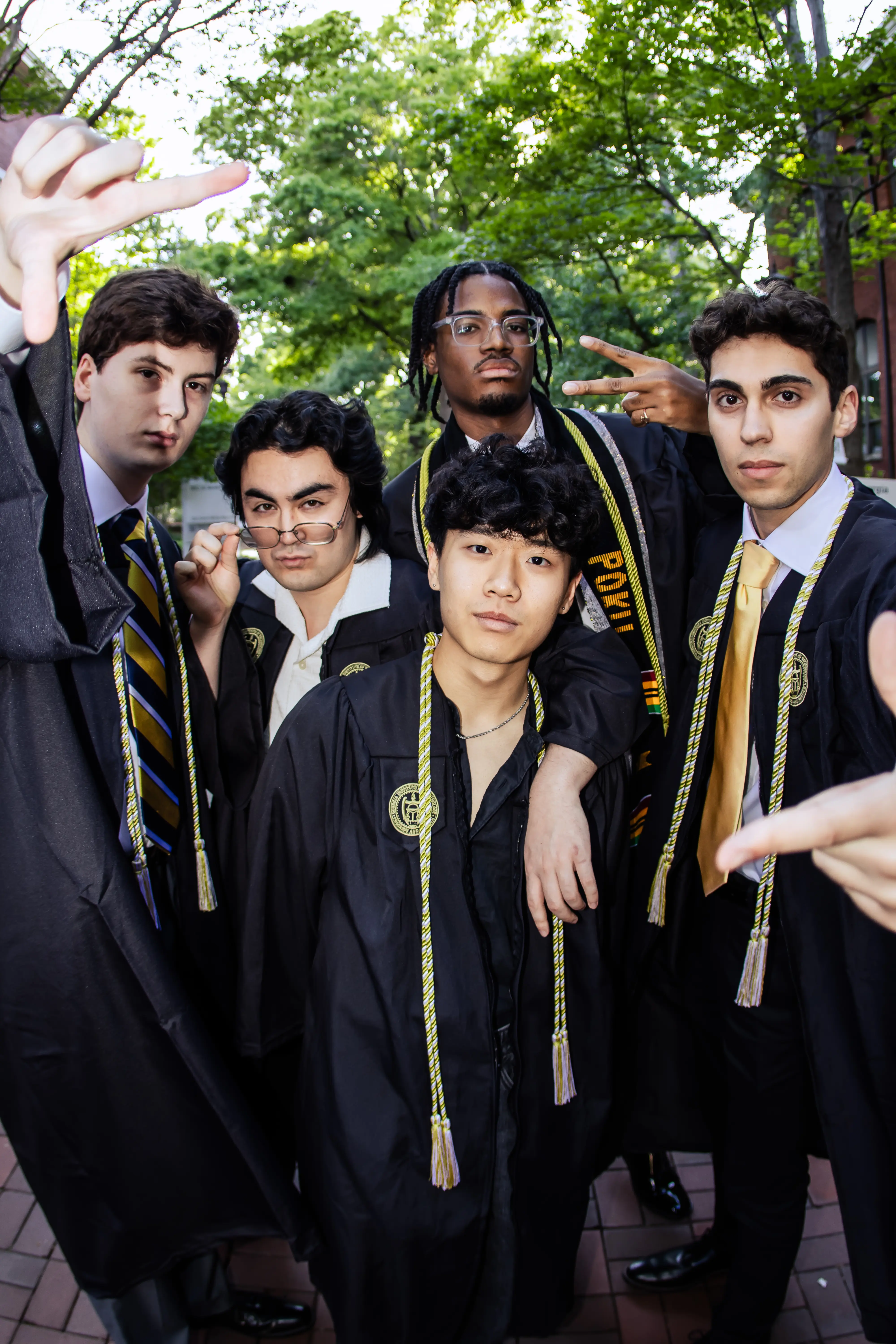 Kyle with friends at graduation