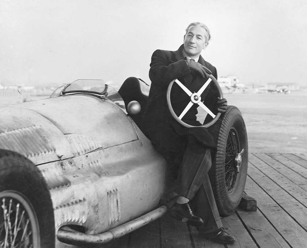 A young Zora Arkus-Duntov seated in an early racing car