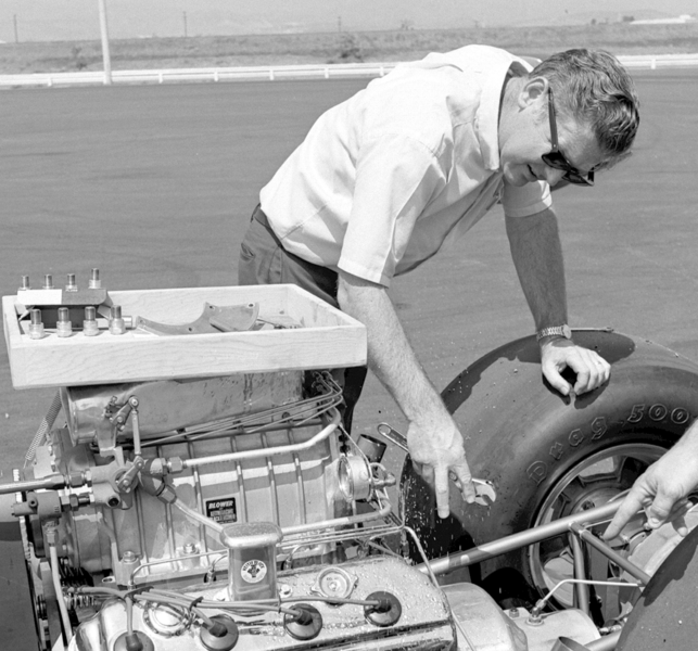 Keith Black working on a supercharged drag racing engine at the track