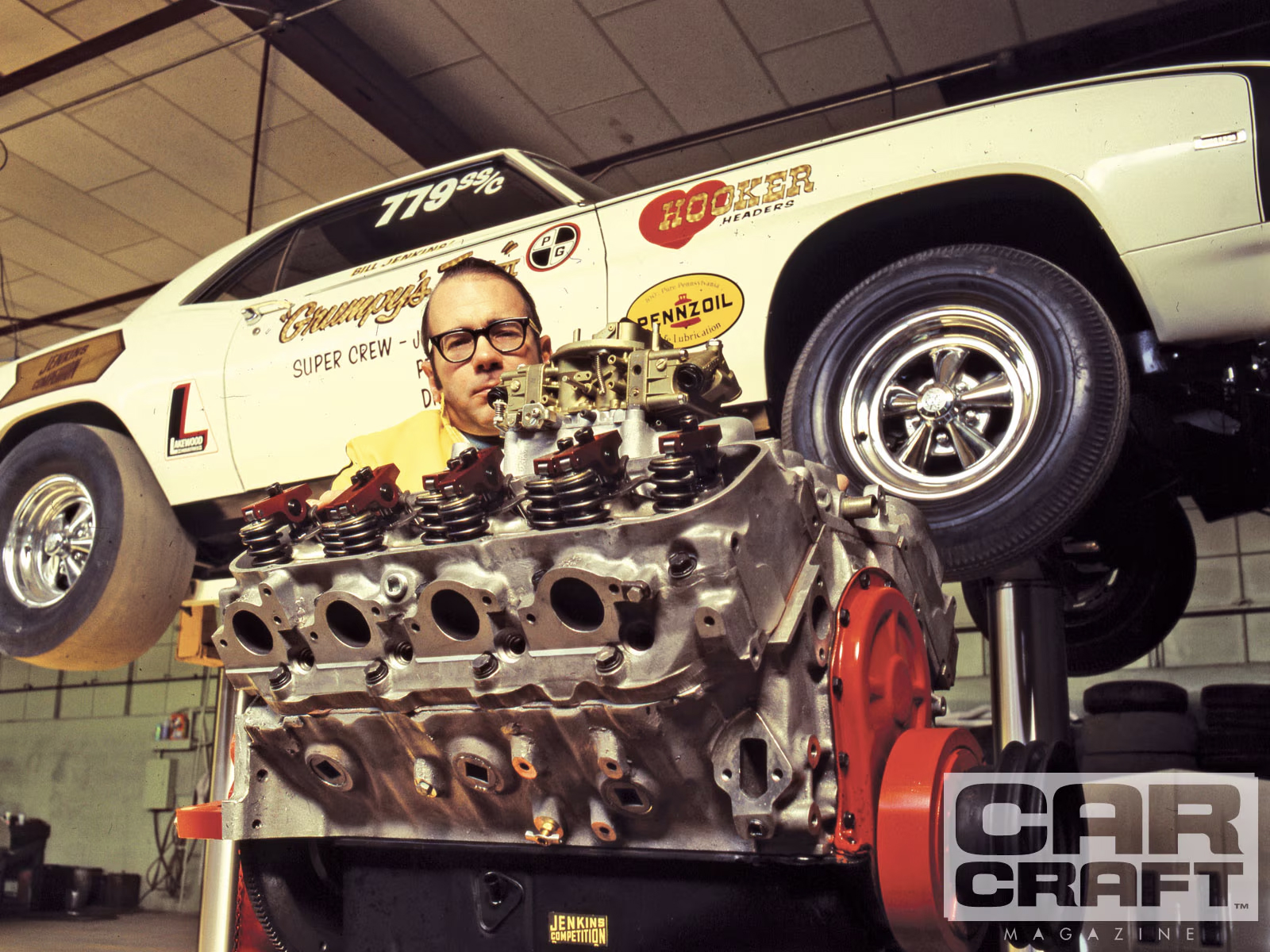 Bill Jenkins behind a small-block Chevrolet racing engine with Grumpy's Toy in the background