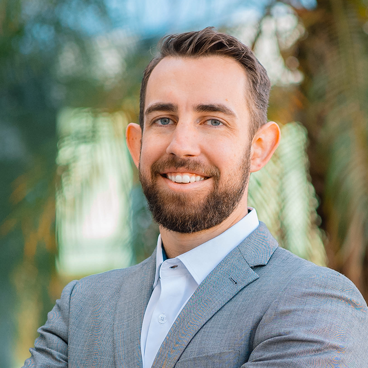 A man with a beard wearing a suit.