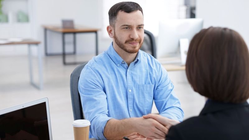 Attorney consulting with a client about a whistleblower retaliation case at a California law firm