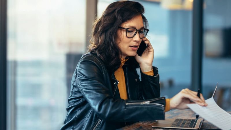 A California employee on a phone call with the EDD while reviewing her unemployment claim documents